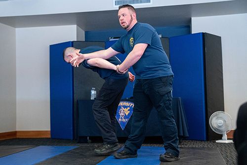 Lt. Jeff Wright demonstrates a self-defense technique during a P.R.O.T.E.C.T. training